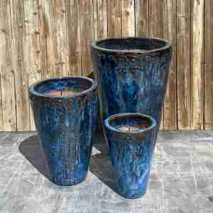 3 tall blue black jars