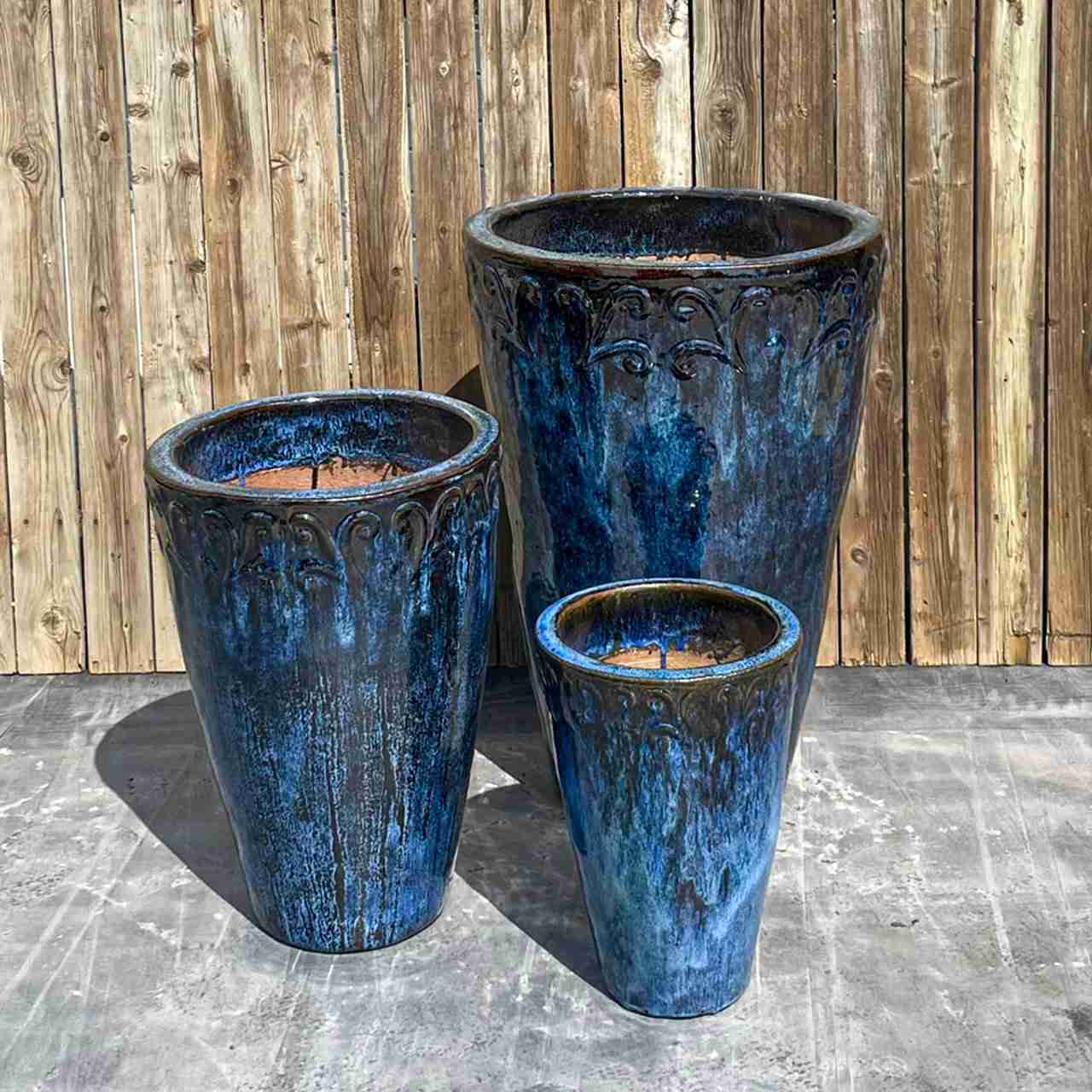 3 tall blue black jars