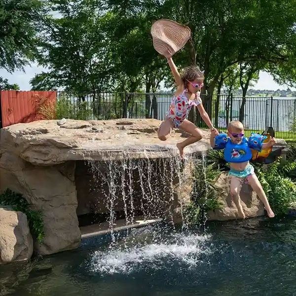 SUNSET GROVE Pool Waterfall by Universal Rocks